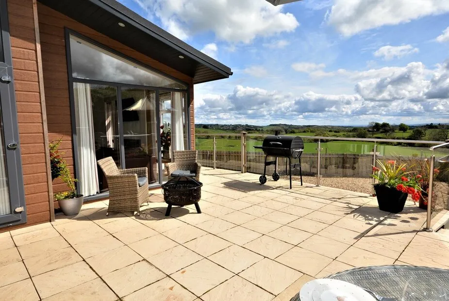 duchal lodge with hot tub garden area with bbq