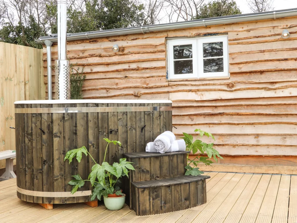 Seabright Lodge, St Austell, Cornwall. Exterior view with wood burning hot tub